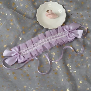 White mesh yarn lace hairband with back clips lolita hair accessory featuring lavender satin bow and trailing ribbons on grey star tulle background showing sweet lolita hair decoration styling