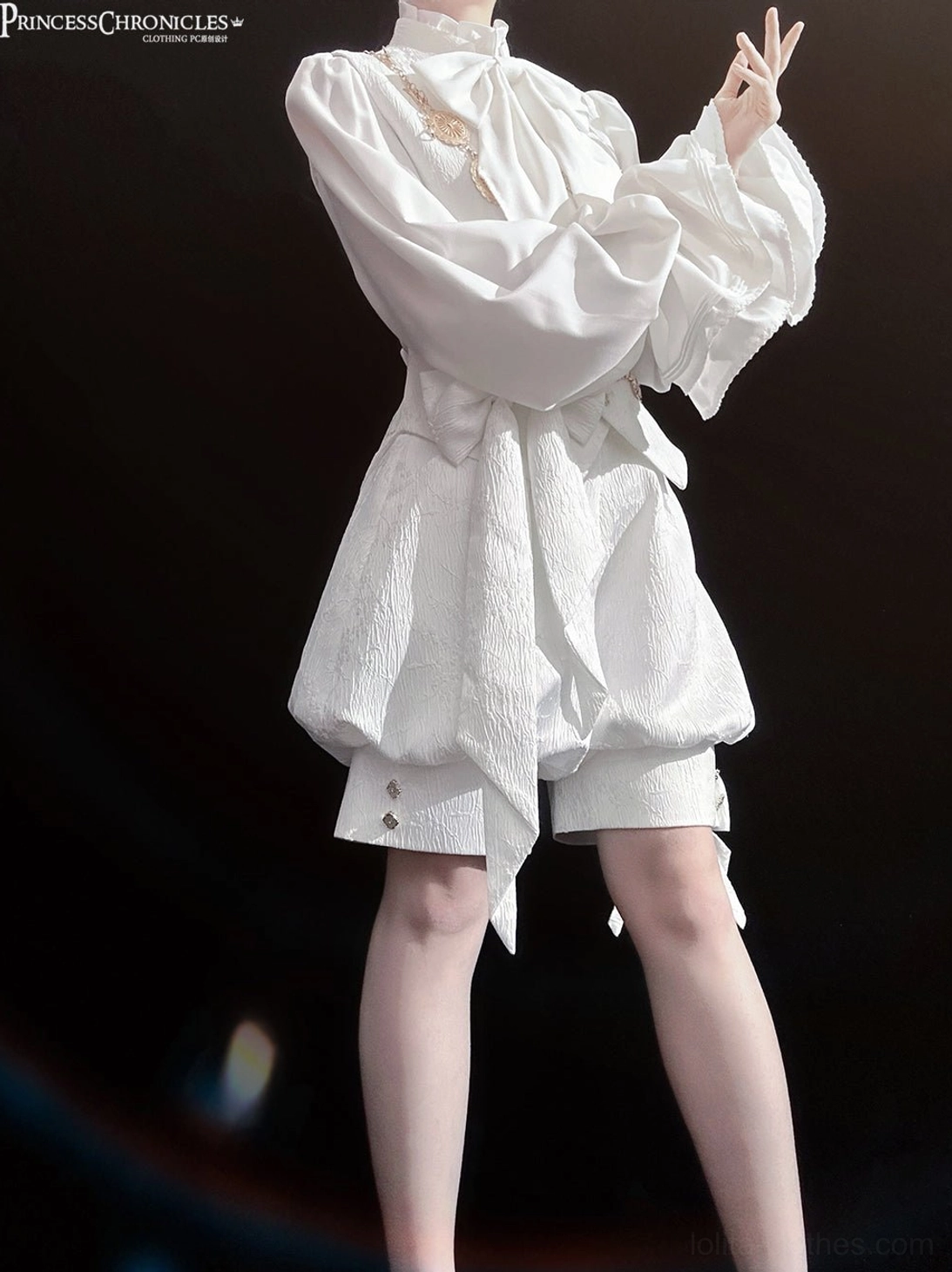 White ouji lolita vest formal waistcoat vintage jacquard textile close-up showing dimensional weave and button hardware