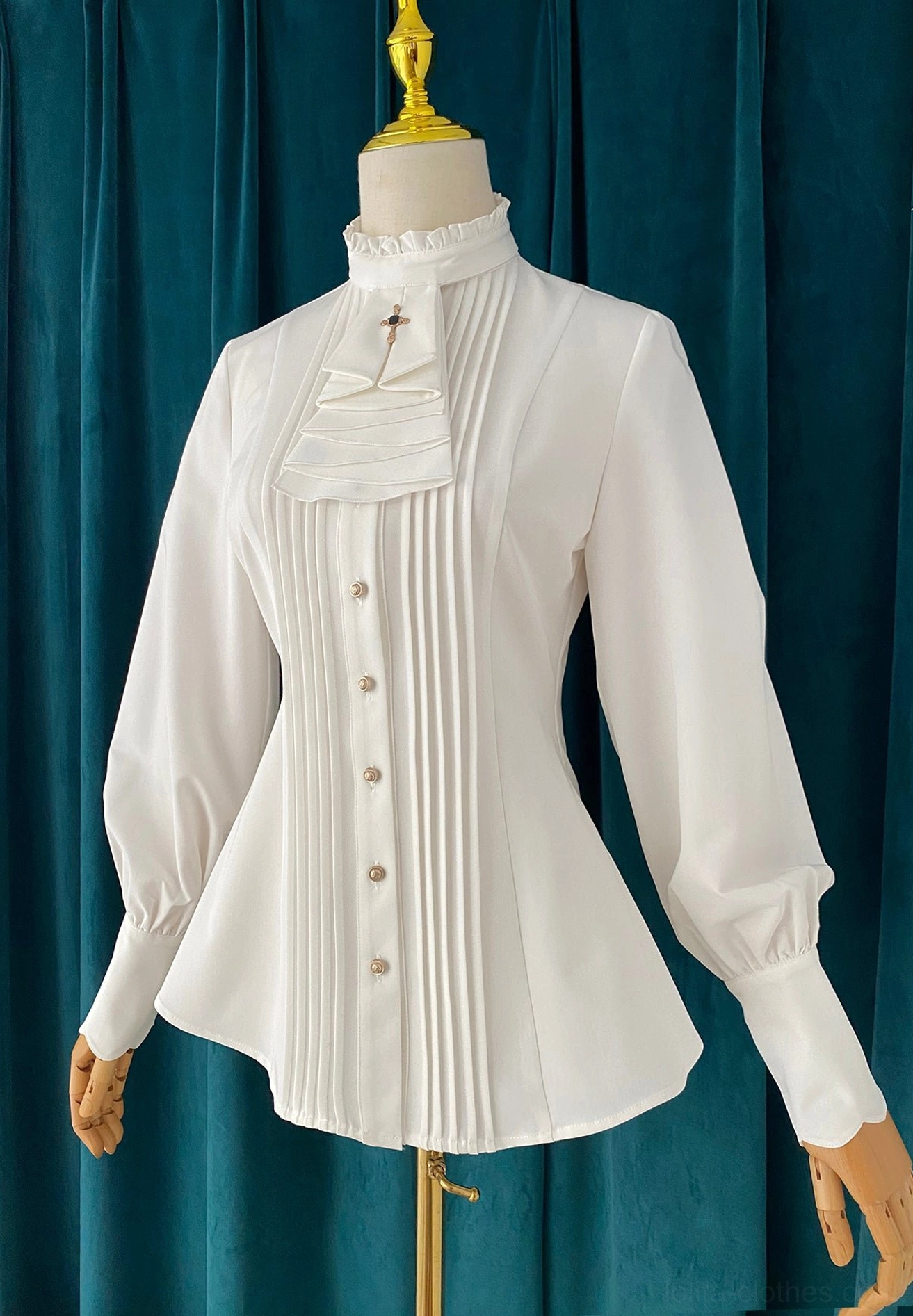 White mutton sleeve stand collar Lolita blouse with ruffled collar front full-body display on dress mannequin dark green velvet background