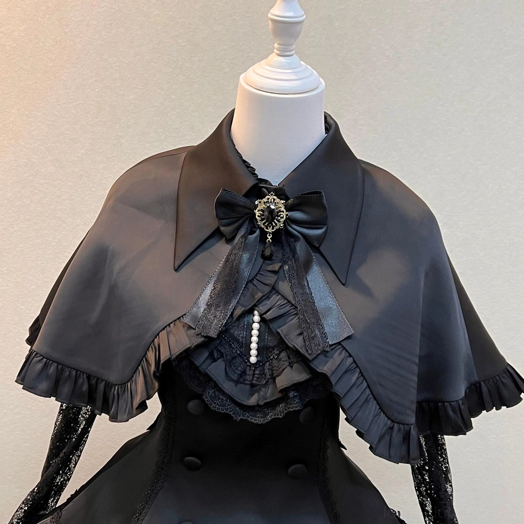 White Nocthymn Cross Gothic Lolita dress petal-shaped hem with heart lace accents and ruffled layering construction side view detail