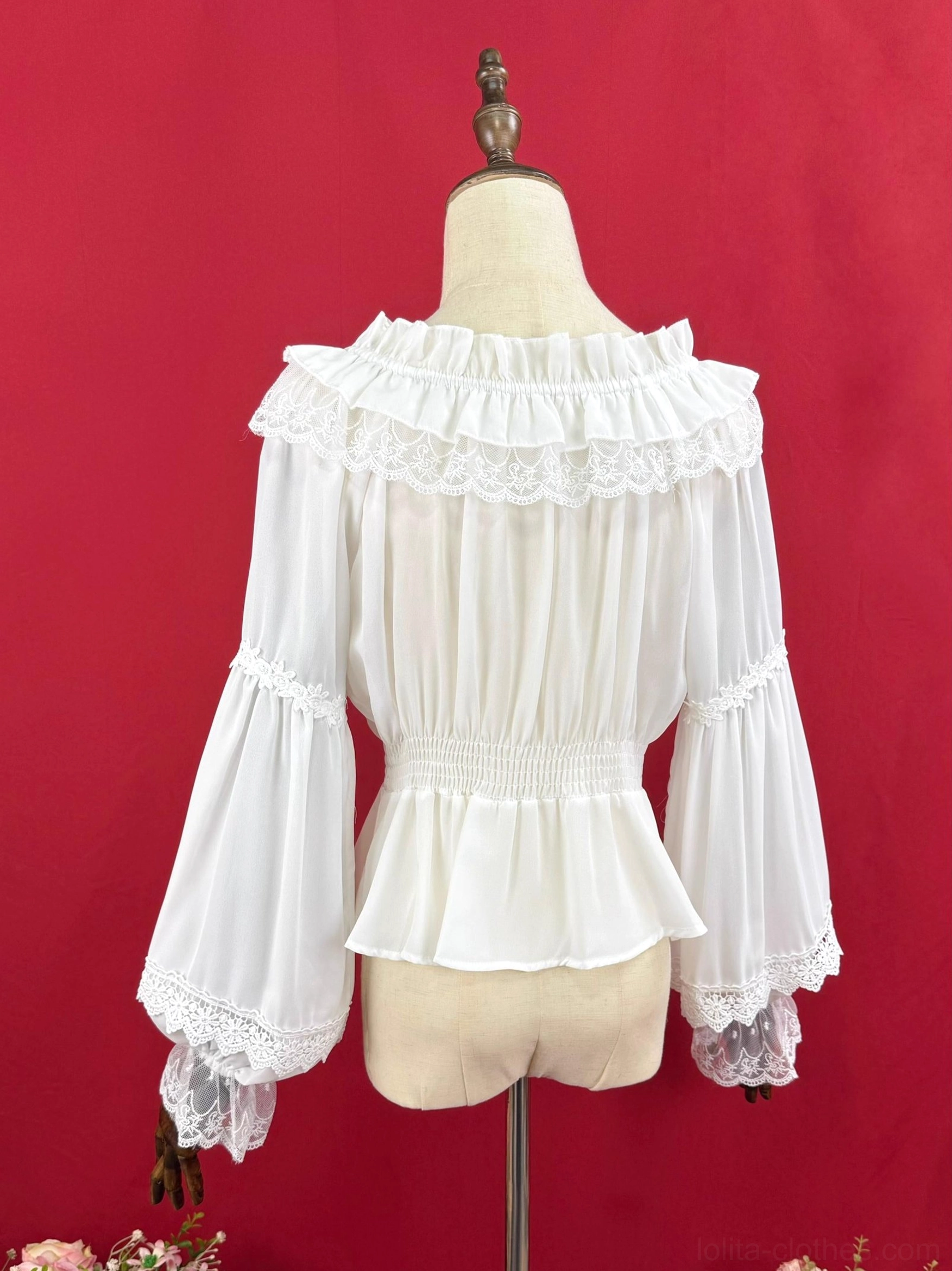 White off-shoulder Lolita blouse back view showing ruffled lace yoke elasticated peplum waist and lace-trimmed bell sleeves detail