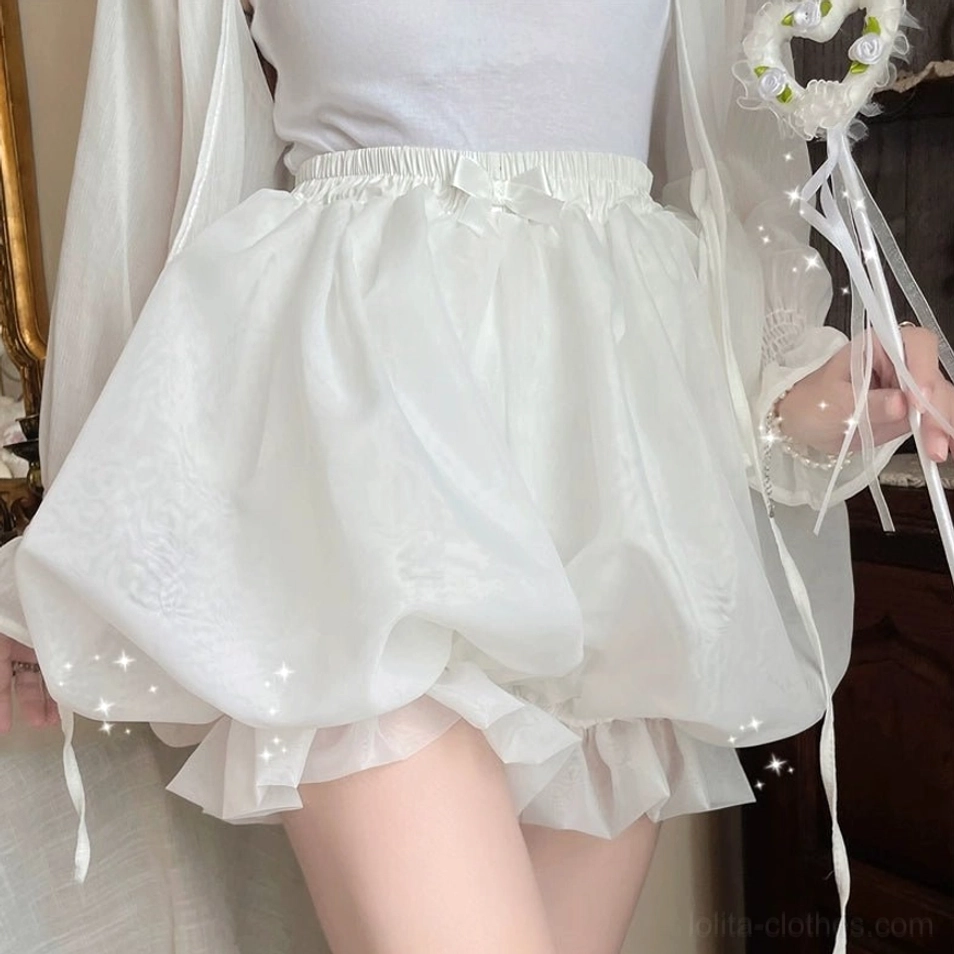 White ethereal organza lolita bloomers close-up front view showing elasticated waist with decorative satin bow and triple-layer ruffled hem detail