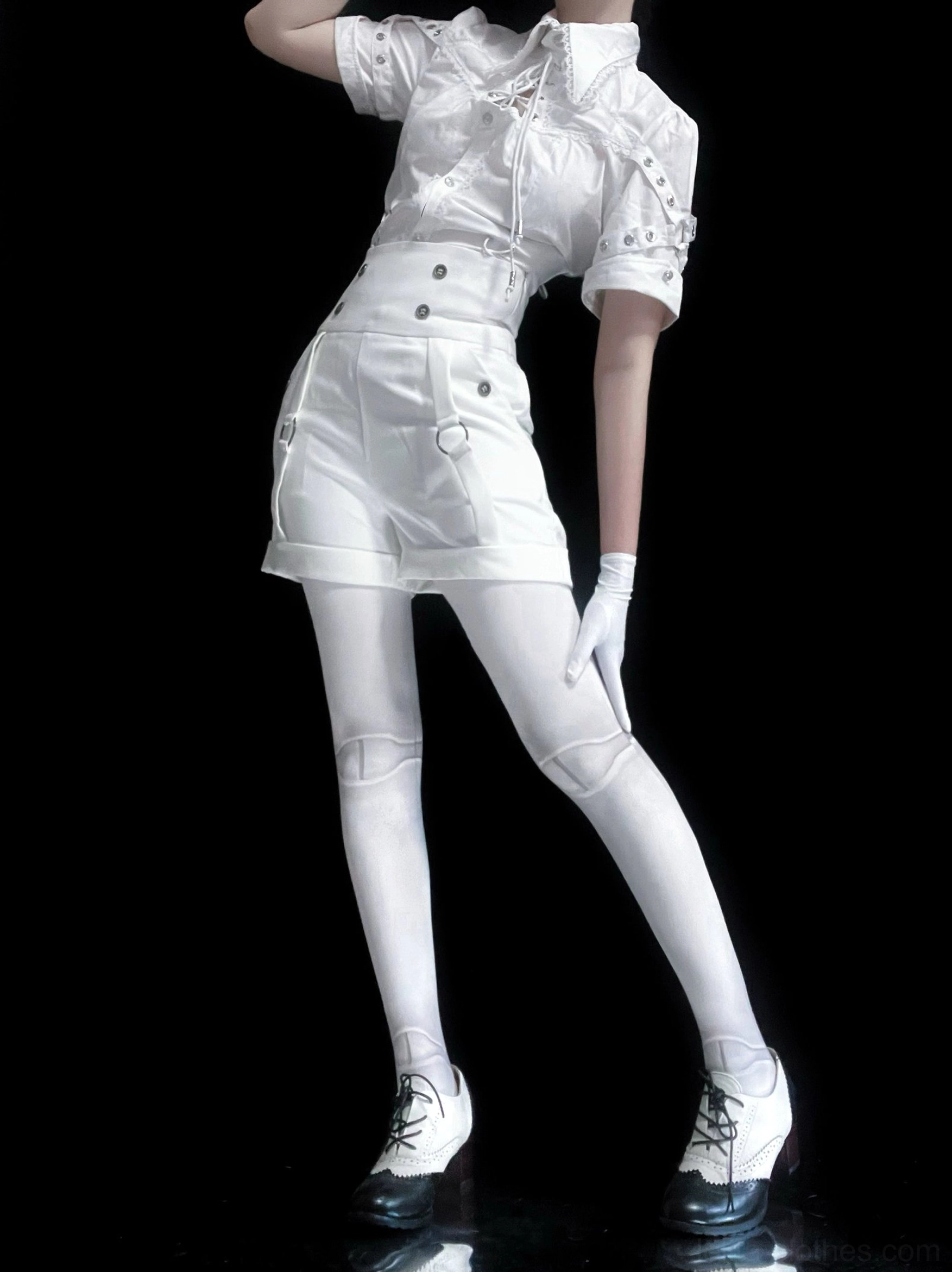 Full white Ouji Lolita outfit complete ensemble on model including blouse, shorts and stockings, full-body side profile on black background, model wearing formal white gloves and lace-up platform heels, showing short sleeves with decorative strap details and high-waisted tailored shorts