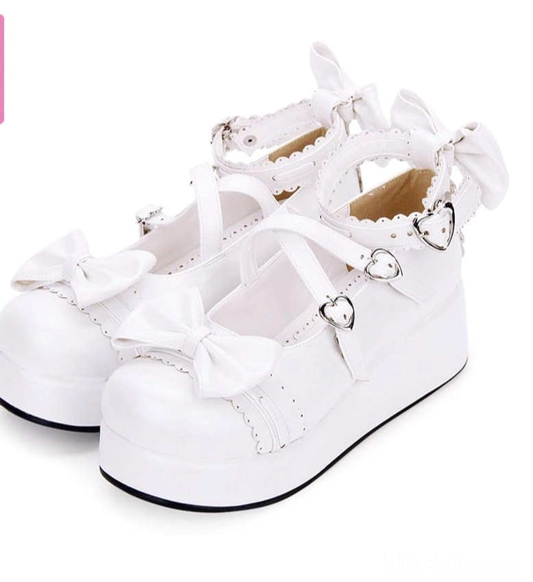 White pearl silver-toned sweet Lolita platform Mary Jane shoes three-quarter side view featuring crisscross ankle straps and vamp bow accent