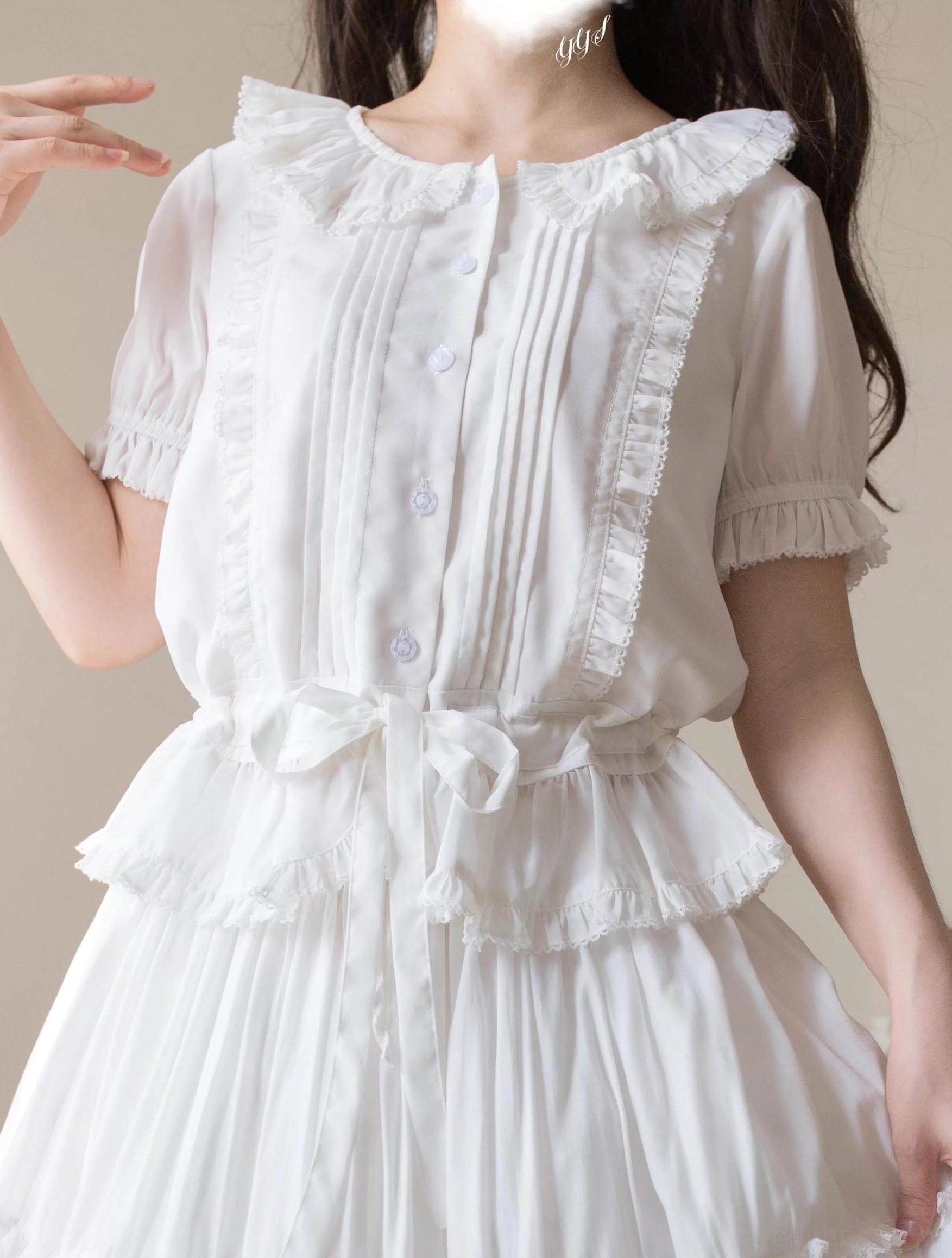 Pure white Peter Pan collar sweet Lolita blouse front view showing ruffled collar, front button placket, pintuck details, and short puff sleeves with elastic cuffs