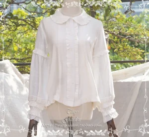 White vintage peter pan doll collar lolita blouse with ruffled long sleeves and lantern cuffs front view on dress form