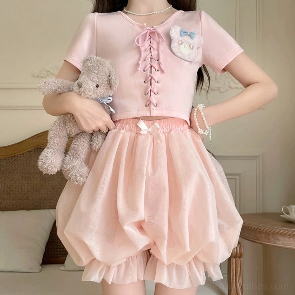 White and pink lolita bloomers color comparison flat lay display showing elasticated waist decorative bows ruffled hems side-by-side
