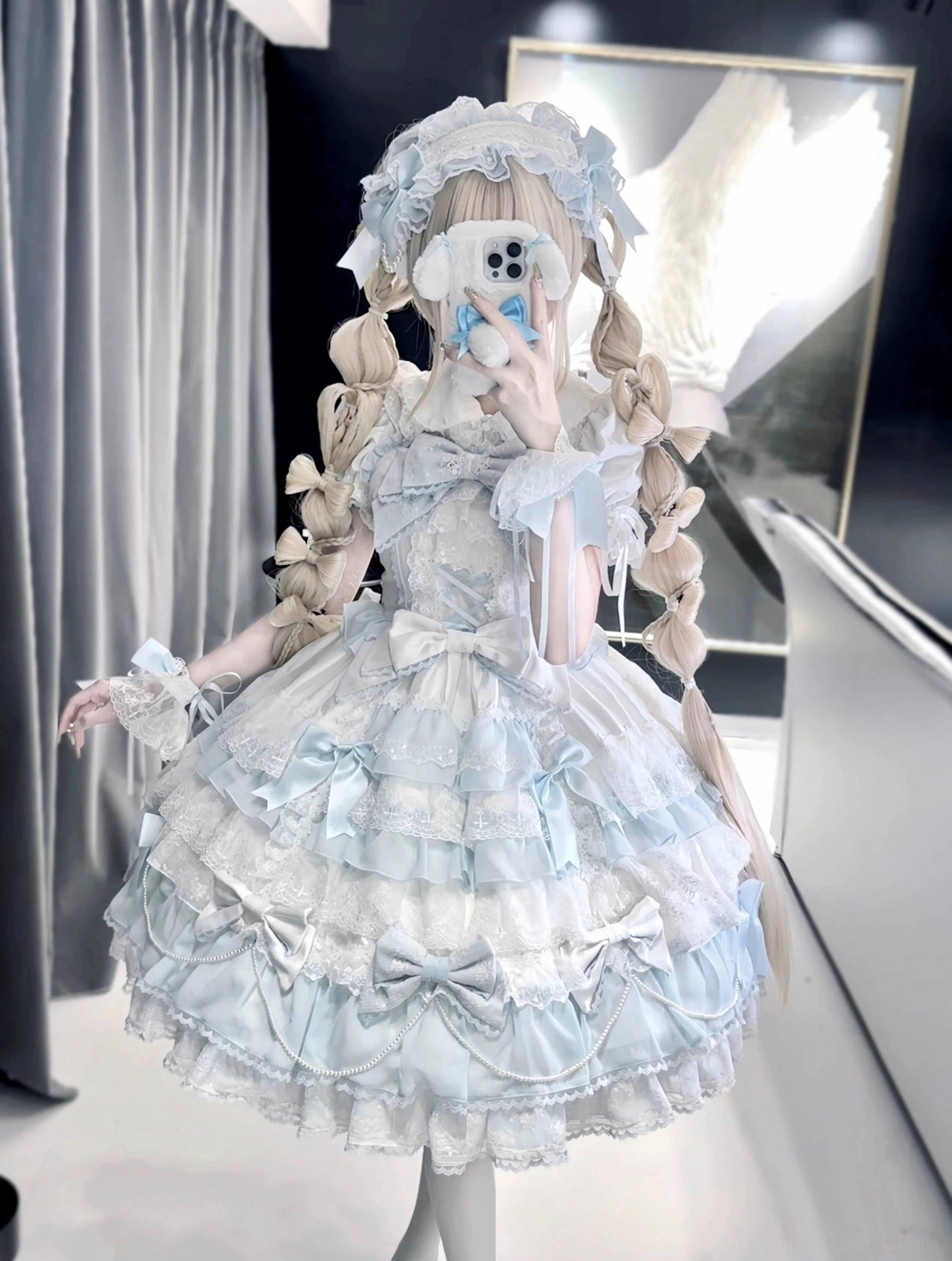 White and pink lolita dress and coordinating accessories white hairband and cuffs showing modular styling options