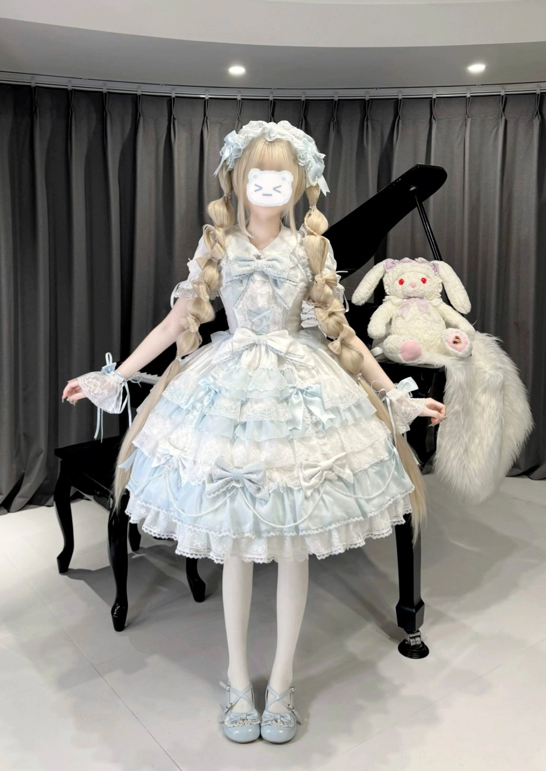 White and pink lolita jumper skirt dress hanging display showing full silhouette multi-layered ruffles and detachable elements