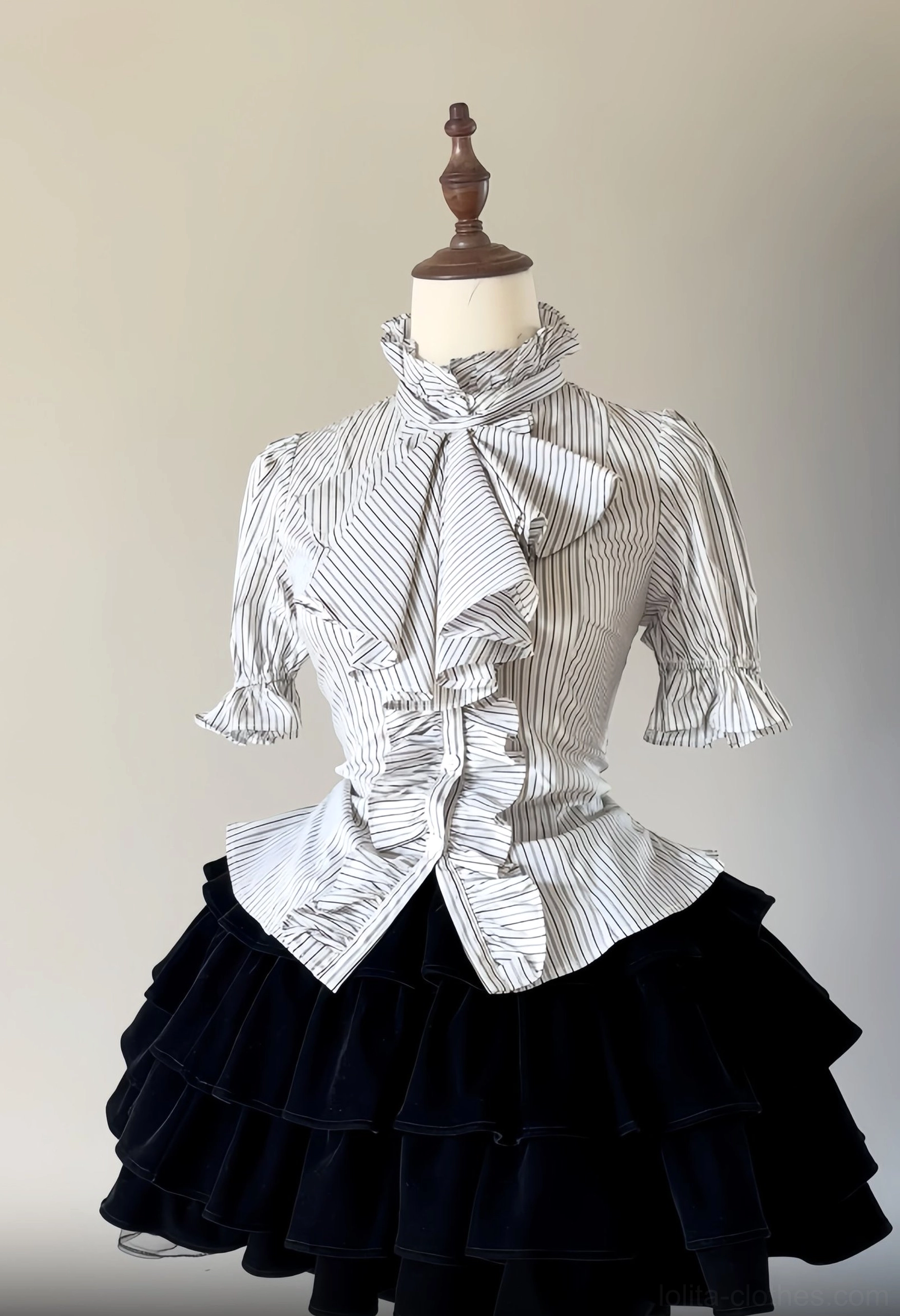 Front flat display of white pinstripe Gothic Lolita short-sleeved ruffled blouse with ruffled stand collar layered front ruffle trim on mannequin