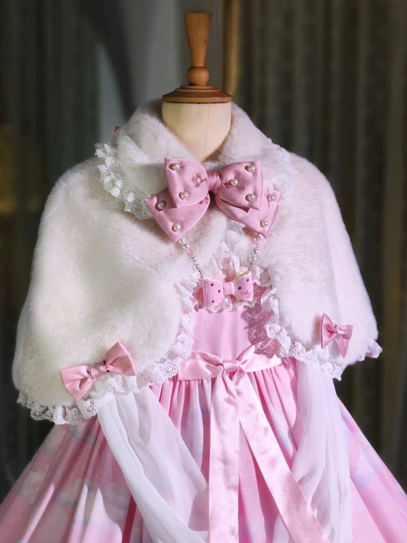 White plush winter Lolita cape with pink pearl bow over pink satin dress close-up front styling
