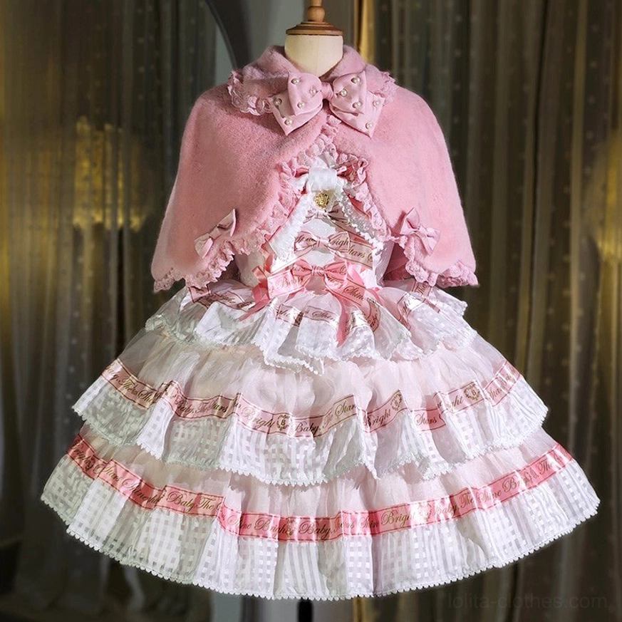 White plush Lolita cape with red decorative bow sweet winter fashion accessory close-up detail