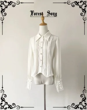 Pure white vintage pointed collar Lolita long-sleeve shirt with pleated front placket and lace trim, displayed on dress form in studio setting, front view showing ruffled buttoned cuffs and tailored silhouette