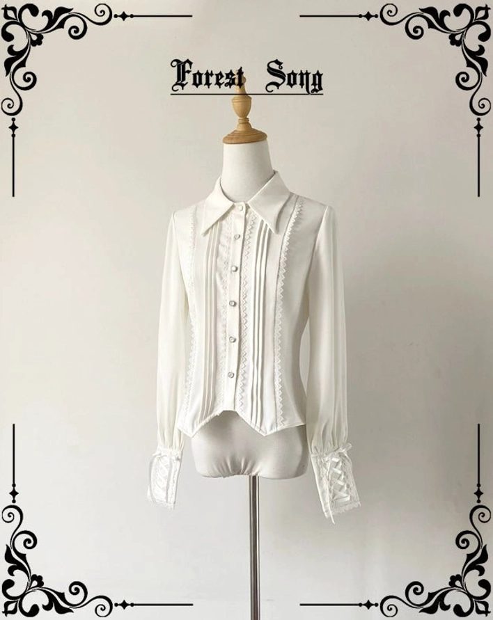 Pure white vintage pointed collar Lolita long-sleeve shirt with pleated front placket and lace trim, displayed on dress form in studio setting, front view showing ruffled buttoned cuffs and tailored silhouette