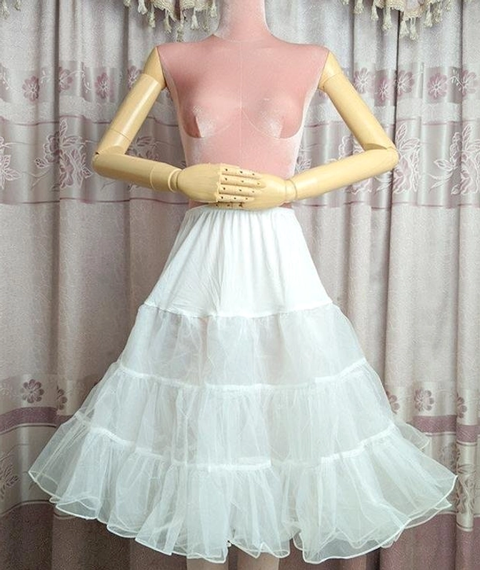 White puffy Lolita petticoat front full view worn on mannequin showing three-tier ruffled tulle A-line silhouette with fluffy volume