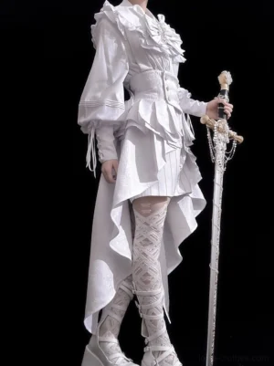 Model wearing white ouji lolita shorts set with rabbit ear hat three quarter side profile holding decorative rapier and wearing lace wrap thigh high socks