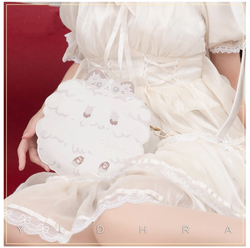 White ragdoll kawaii cat leather shoulder bag front view worn with white ruffled lolita dress and red studio backdrop, showing soft cat embroidery and adjustable strap