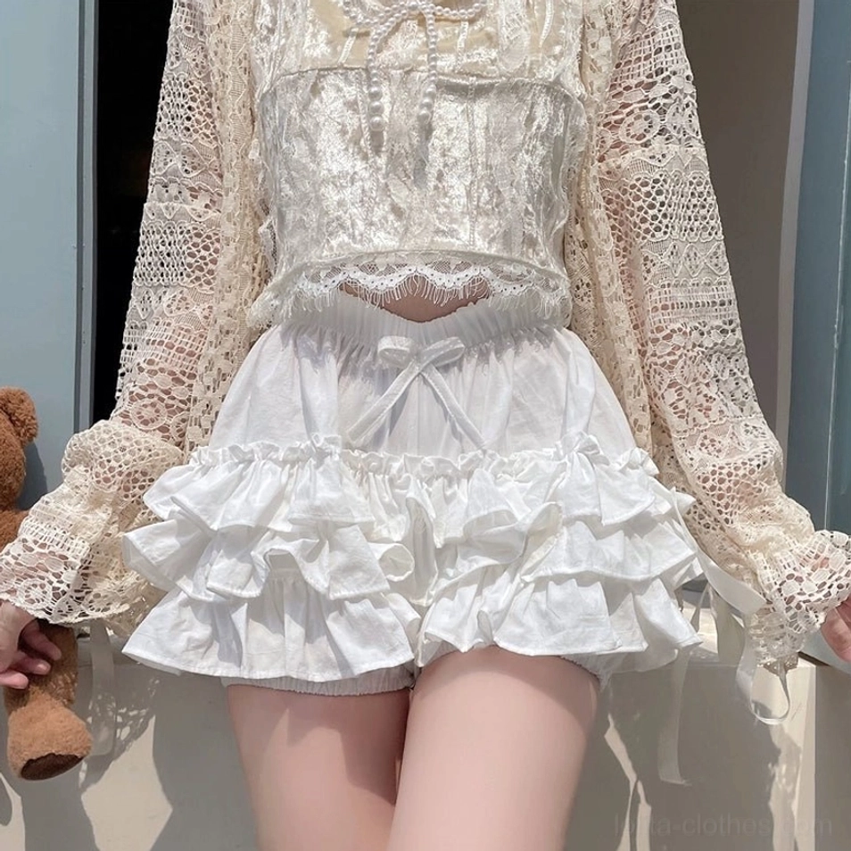 White ruffle bloomers ruffle hem detail layered construction voluminous cute silhouette close-up view tiered ruffles aesthetic