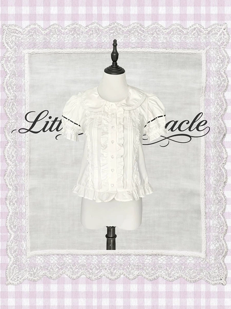 White ruffled short-sleeve Lolita blouse lace trim collar cuffs neck bow vintage silhouette front view