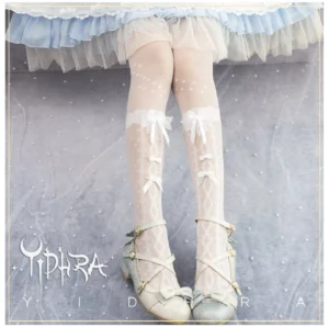 White sheer lolita mid-thigh stockings with polka dot prints and bowknot cuff decorations paired with light blue frilly lolita skirt and cross-strap shoes