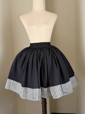 White stripe lolita skirt front view dress form high-waisted pleated full skirt with contrasting striped hem detail clean aesthetic