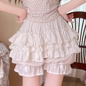 White sweet lolita bloomers with multi-layer ruffles and satin bow leg cuffs, back waist view showing pleated sheer fabric detail