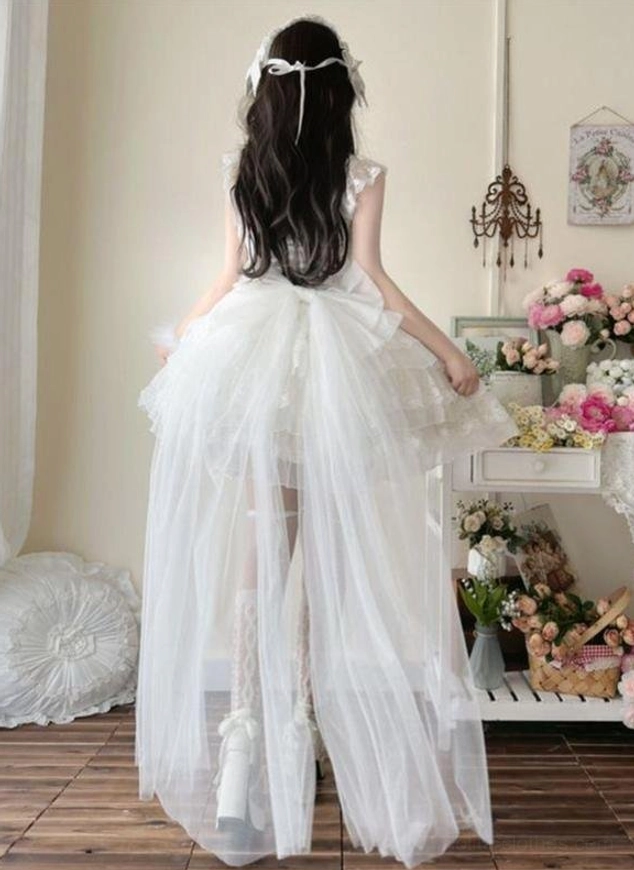 White sweet lolita JSK with long sheer tulle train and low back design, back full-body view showing ruffled tiered skirt silhouette