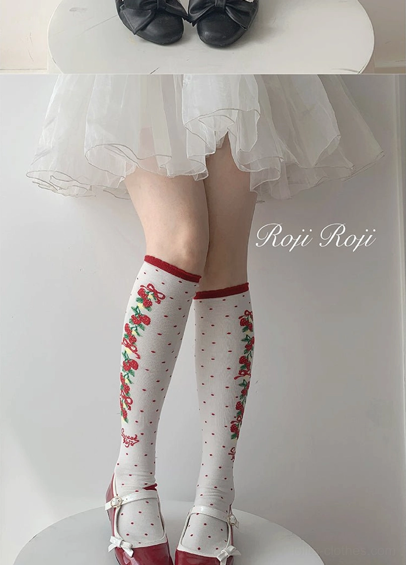 white sweet lolita knee-high cotton socks red cherry prints red cuff trim polka dots round display stand mary jane shoes minimalist background