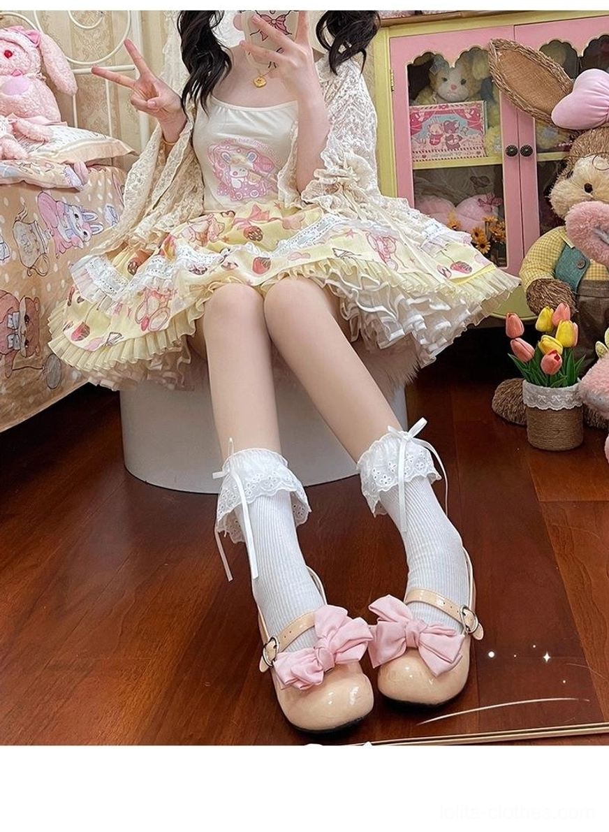 White mid-calf lolita socks with lace ruffle and bow paired with yellow floral sweet lolita dress, full outfit coordinate view