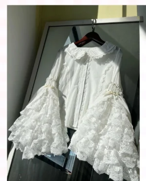 White Sweet Lolita lace blouse with Peter Pan collar and layered hime trumpet sleeves hanging front view