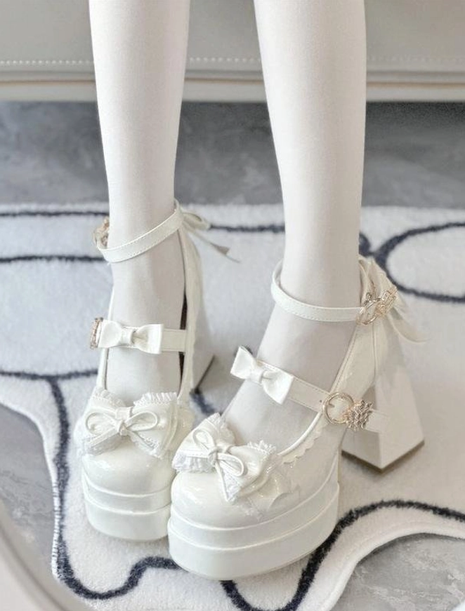 White sweet Lolita round toe platform heels overhead view on-foot wearing with decorative buckles and ruffled bow trim details