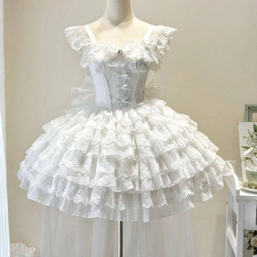 White sweet lolita wedding JSK with detachable tulle trailing overlay, showcasing crisp white polyester construction and pristine condition