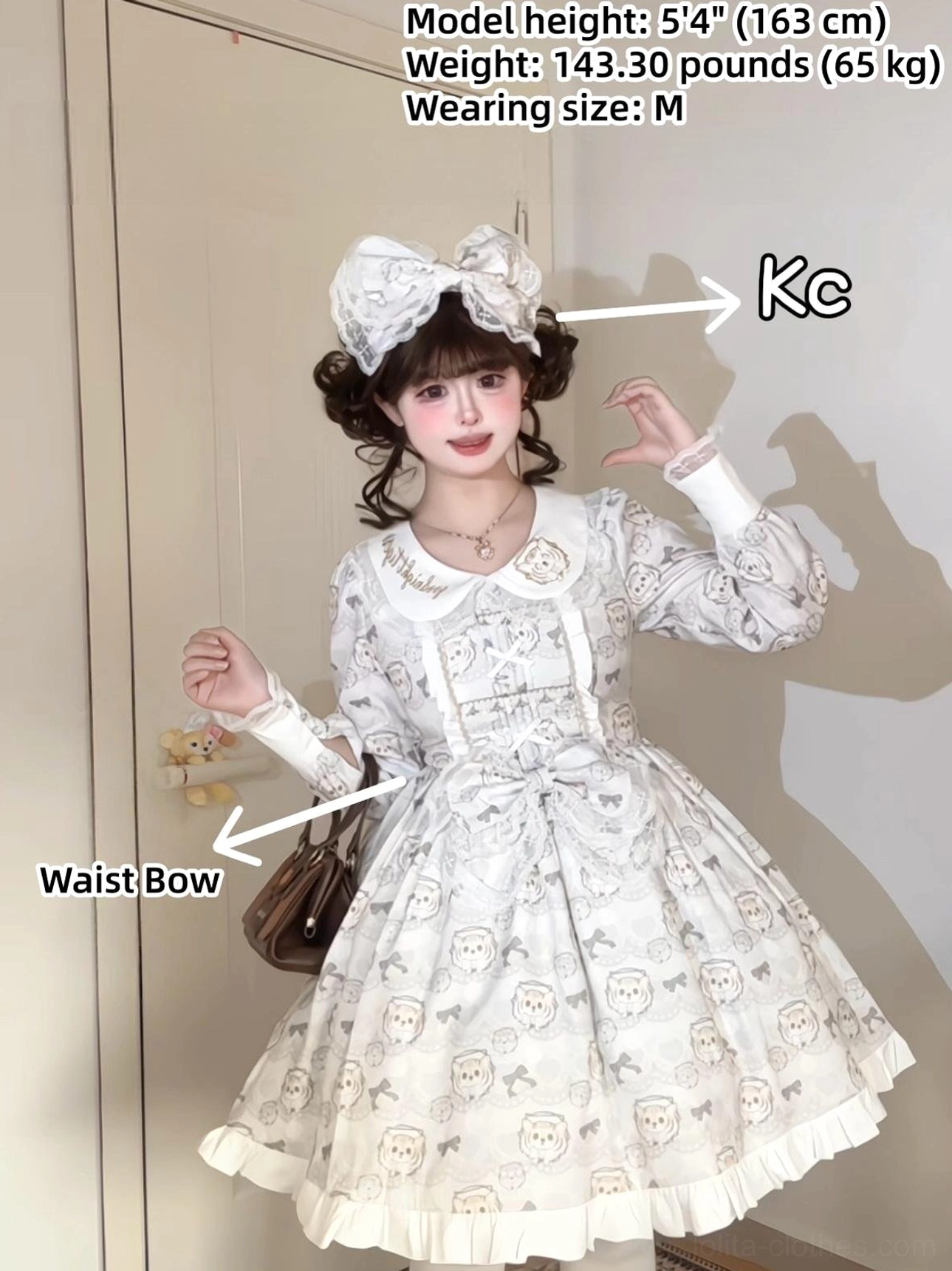 White tiger print lolita OP dress full body mirror shot showing Peter Pan collar oversized bow headpiece puff long sleeves and front waist bow decoration on model