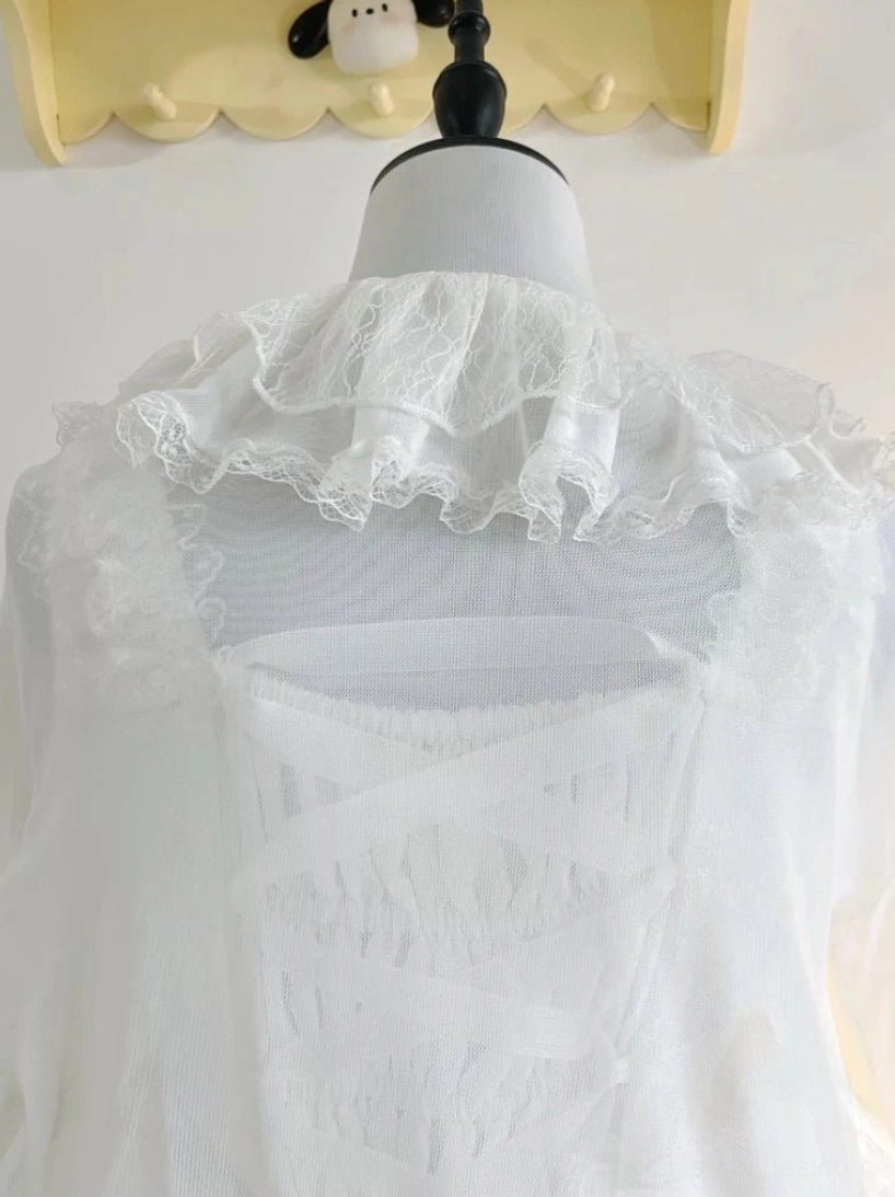 Back view close-up of white tulle lolita bolero cardigan on dress form, featuring standing lace ruffle collar and criss-cross strap back design with sheer chiffon