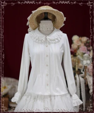White vintage lace Peter Pan collar cotton Lolita blouse with ruffled hem and layered details frontal view on dress form with straw hat dark red floral background