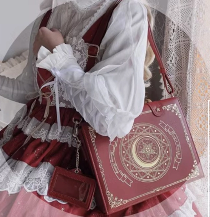 Wine red burgundy magic book lolita crossbody bag with structured book shape and detailed gold magic circle embroidery patterns