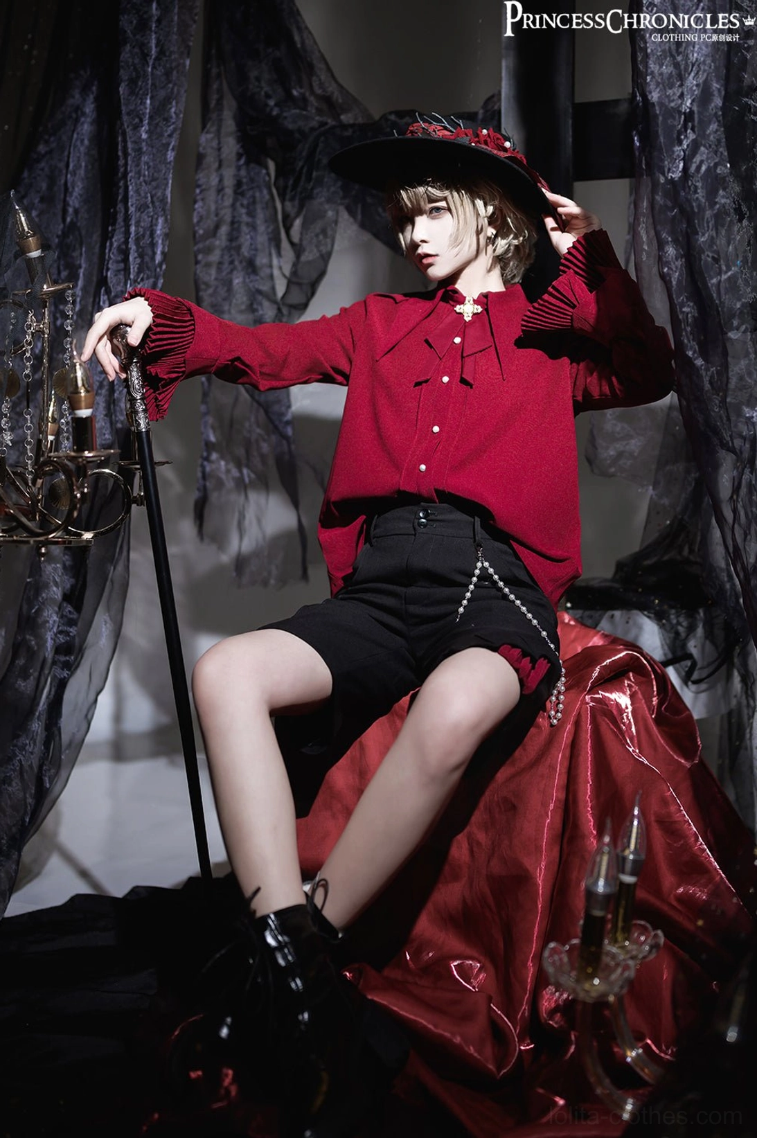 Wine red Ouji fashion shirt three-quarter side sitting full-body view male model gothic cane formal attire