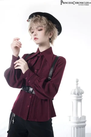 Wine red vintage ouji lolita blouse with pointed bow collar and puff sleeves, front close-up view on androgynous model with structured pleated details