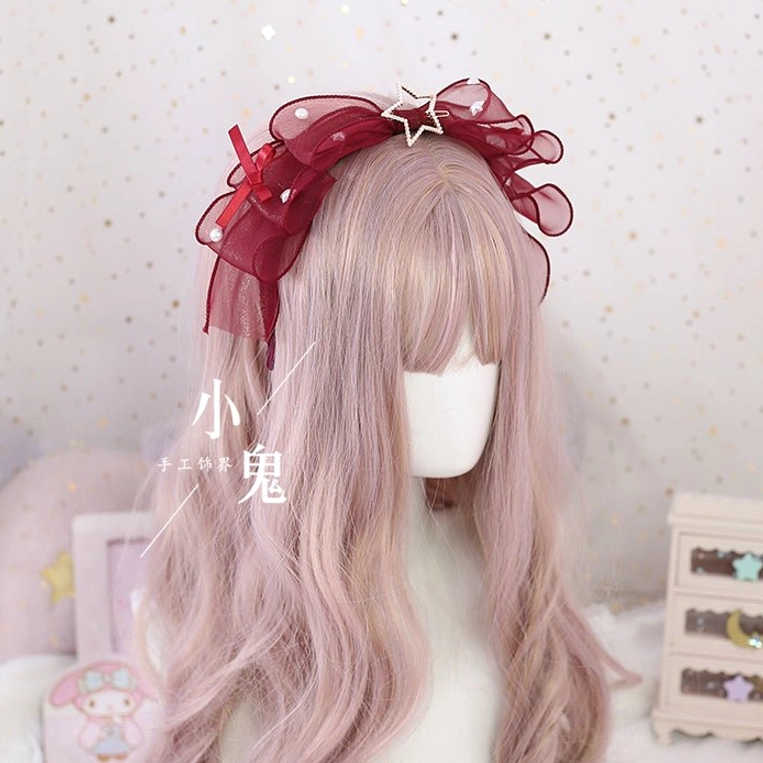 Wine red polka-dot organza lolita bow hair clip with star metal decor and layered ruffled trim on mannequin