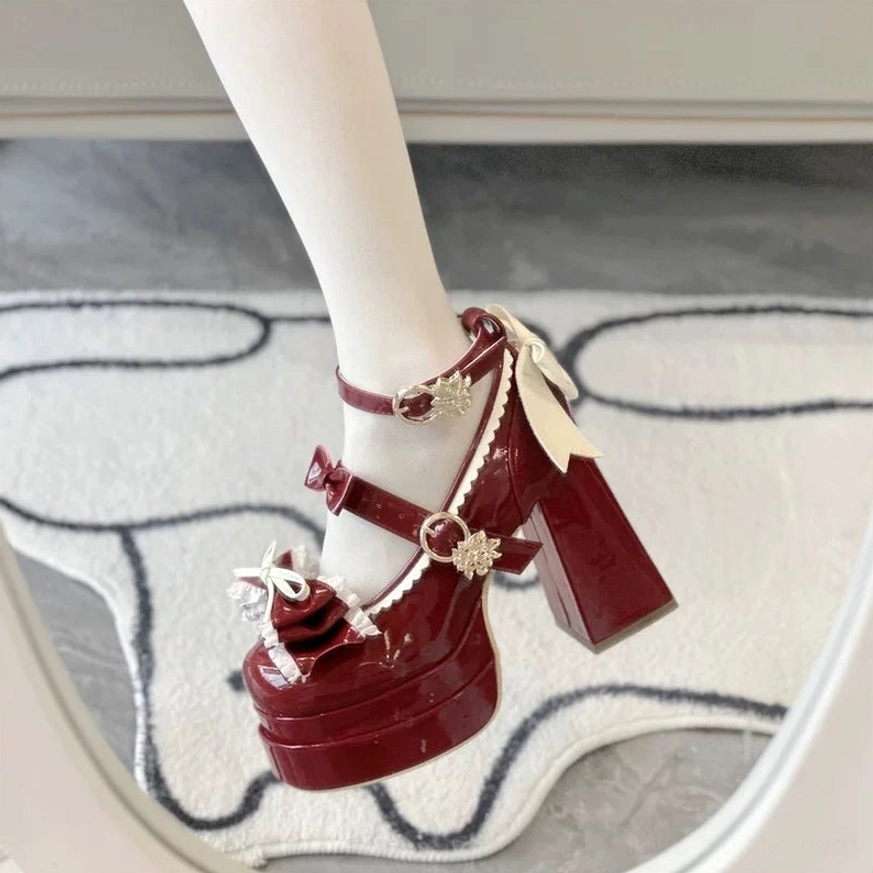 Wine red sweet Lolita round toe platform heels close-up detail view of glossy patent leather and decorative elements