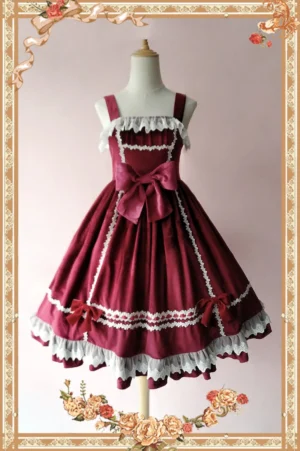 Burgundy wine red velvet Lolita JSK dress with white lace trimmings and front waist bow on dress form with vintage floral frame background