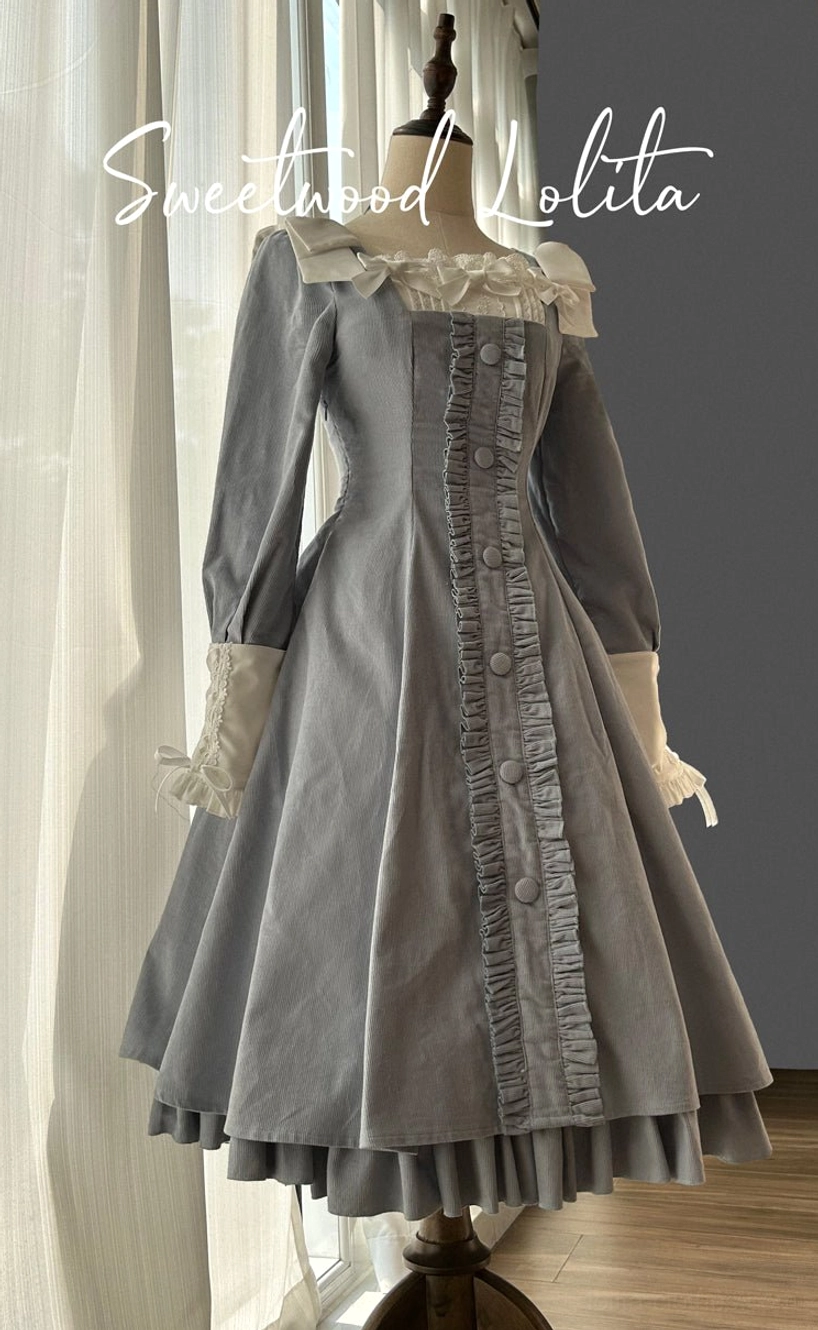 Wine red velvet Lolita OP dress detail photography highlighting corset lacing functionality, button front closure system, and structured bodice construction architectural elements