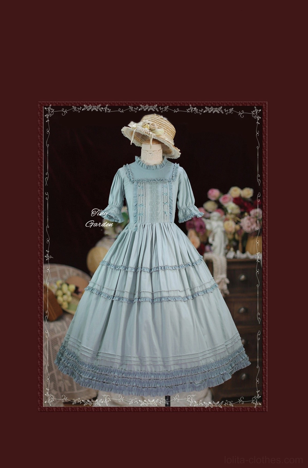Vintage lolita one-piece dress wine red color with ruffled tiered hemline short puff sleeves shown on mannequin with vintage backdrop