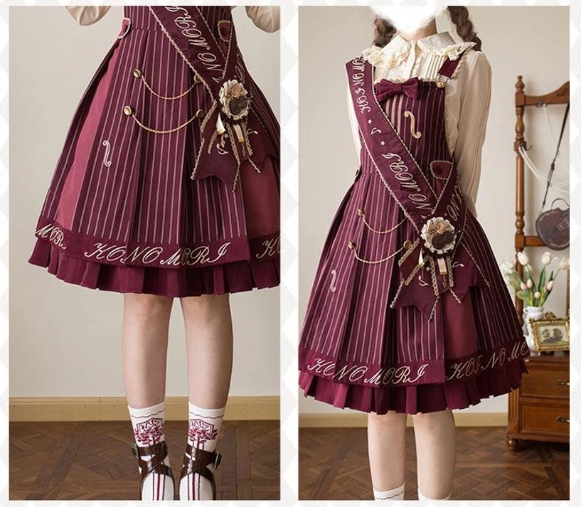 Wine red violin preppy Lolita salopette close-up details including vertical pinstripes musical note chain embroidery ruffled skirt edge and brand letter hem trim
