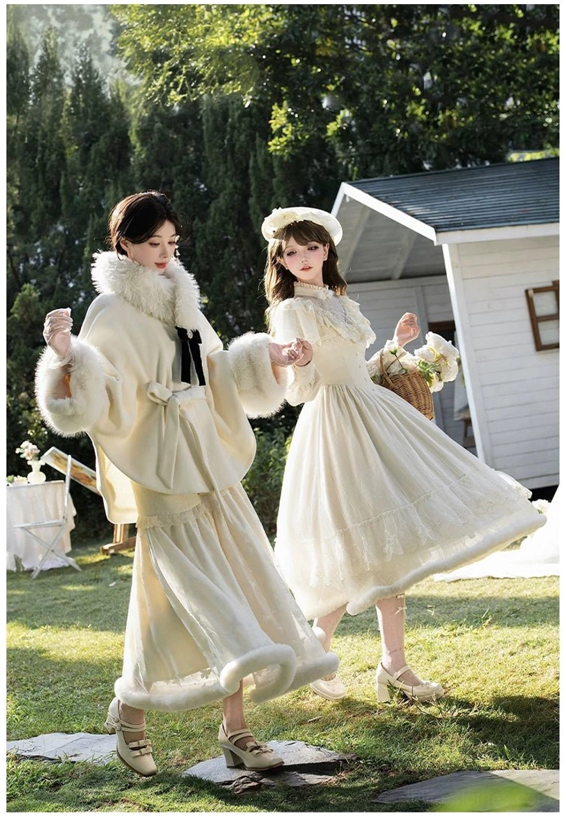 Winter Island Memory lolita suit low angle side full body shot model with flower basket cream white coat faux fur trim black bow garden cottage backdrop