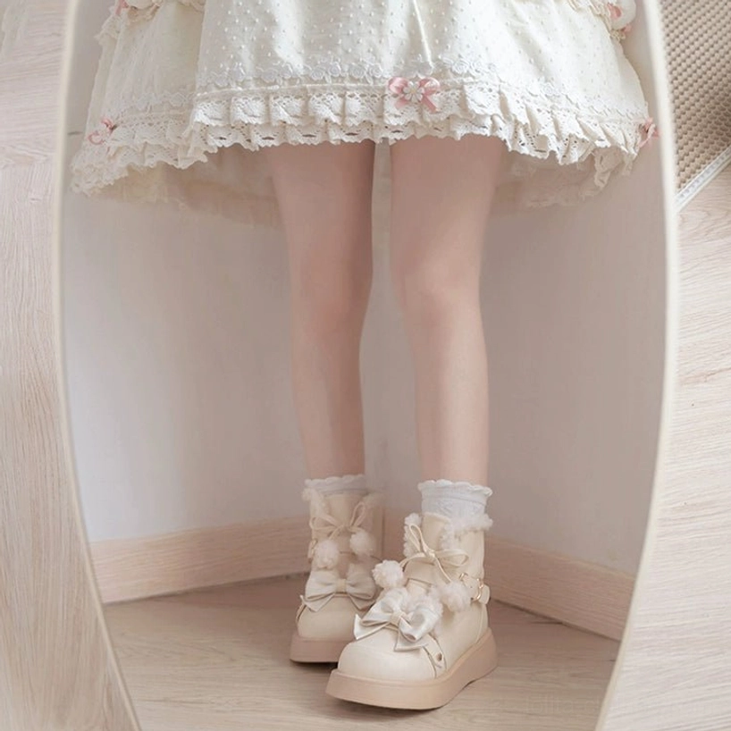 Winter lolita fleece snow boots styled with multiple layered accessories ribbons bows lace details complete aesthetic ensemble