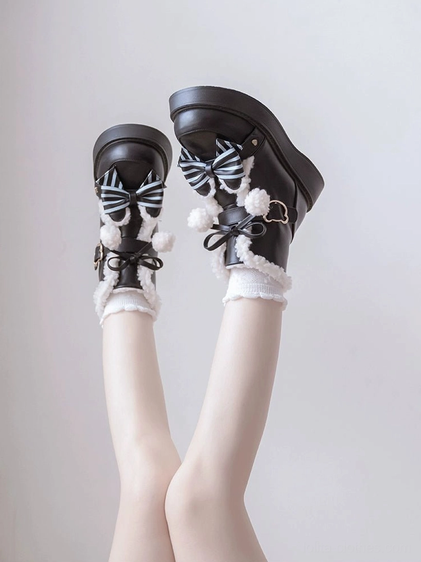 Metal buckle strap closure on winter lolita snow boots adjustable secure fitting practical functional design element close-up
