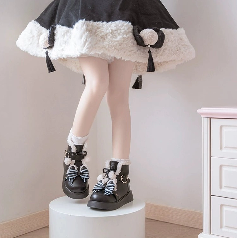Striped bow decoration detail on winter lolita snow boots adorable ornament metal buckle accent charming design element close-up