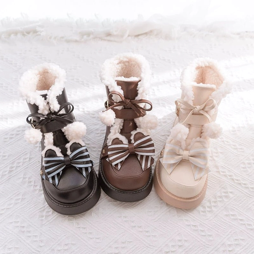 Flat lay display of three winter lolita snow boots in black brown and milk tea color with fuzzy fur collars striped butterfly bows and chunky platform soles on knitted texture background