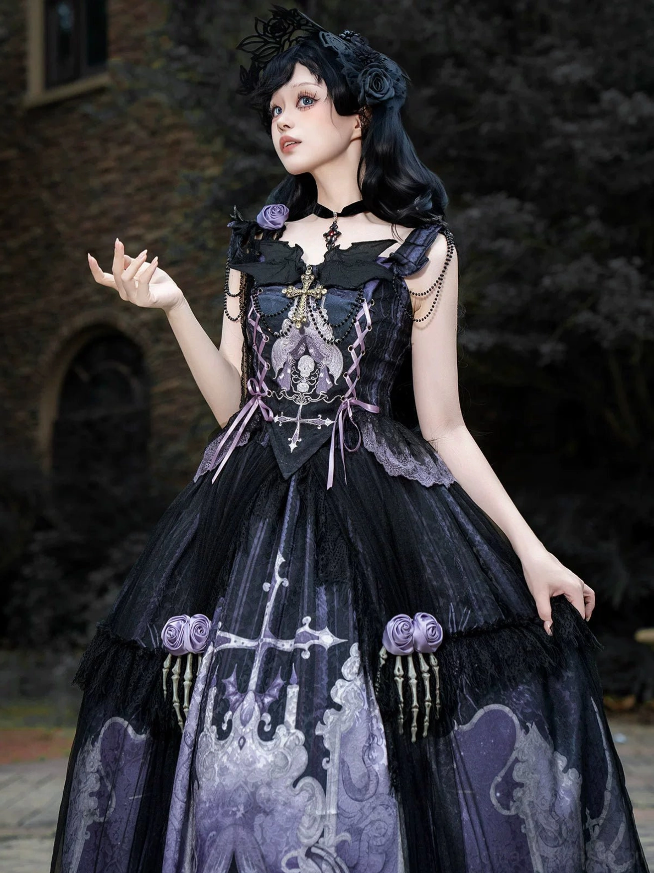 Withered Bone Gothic Lolita set embroidered details showing hand-stitched cross skull motifs dangling bead chains decorative elements on bodice creating dimensional gothic aesthetic
